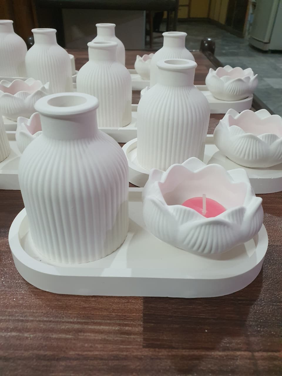 Minimalist white home decor set with ribbed mini vase, tulip pot and oval tray styled with flowers